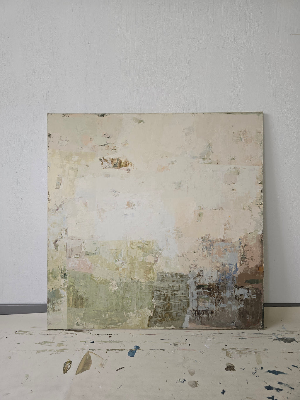 Original Abstract Painting with textured surface on a white wall.
