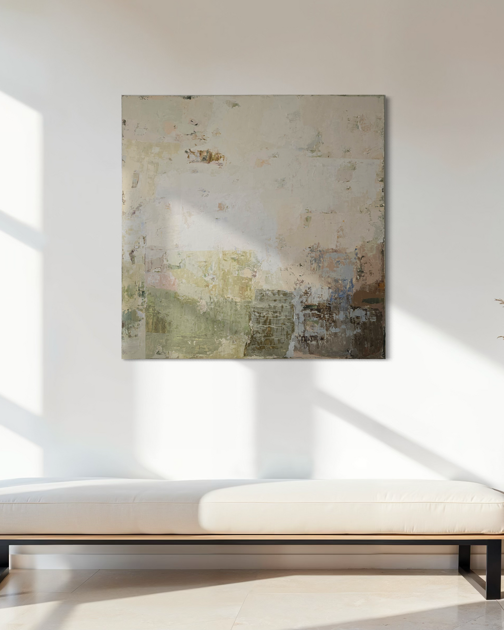 Original abstract painting in warm, beige, soft brown tones on a white wall above a white bench.