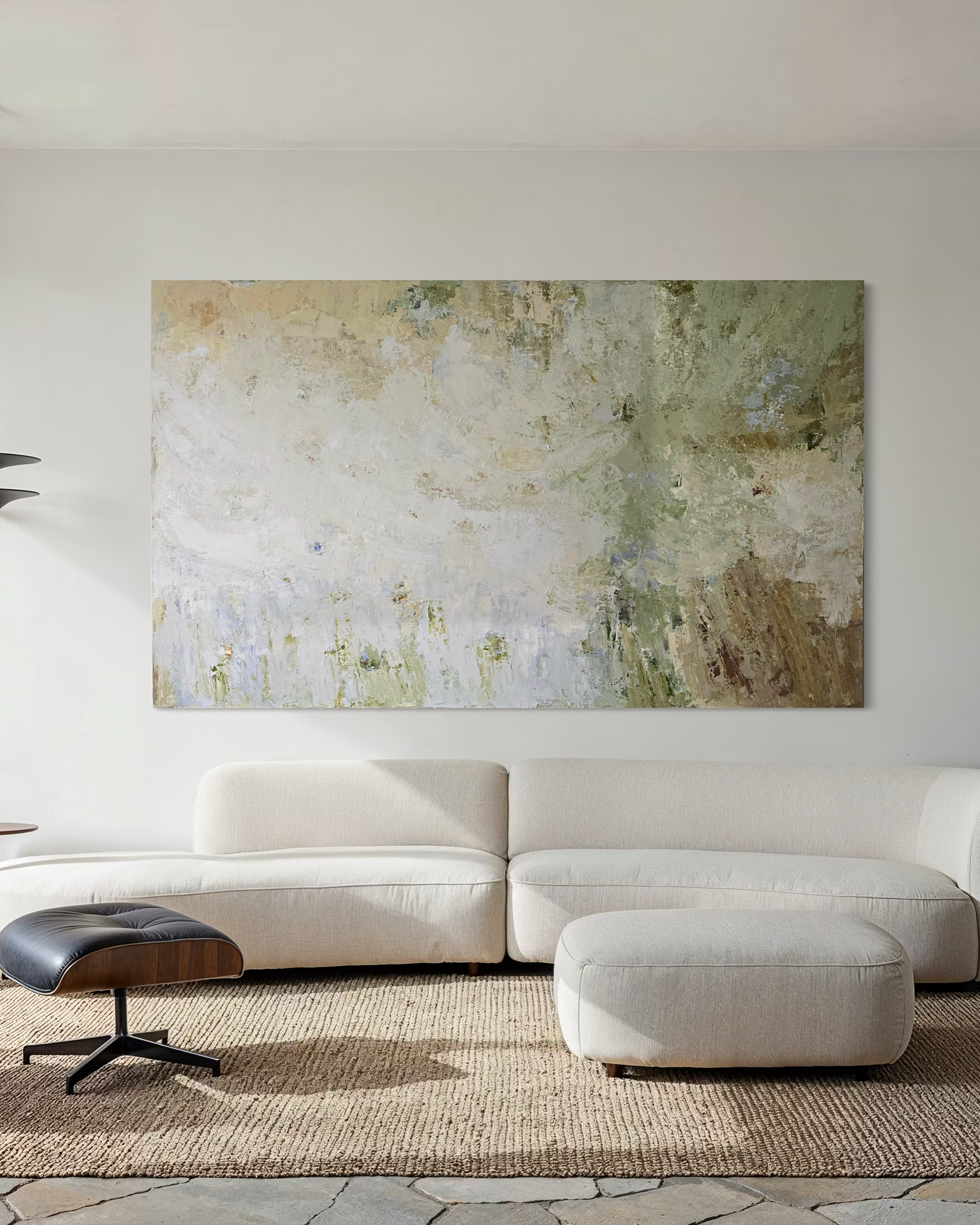 Modern living room with a large-scale abstract painting on the wall above a white sofa. Created by BIRUTE STUDIO.