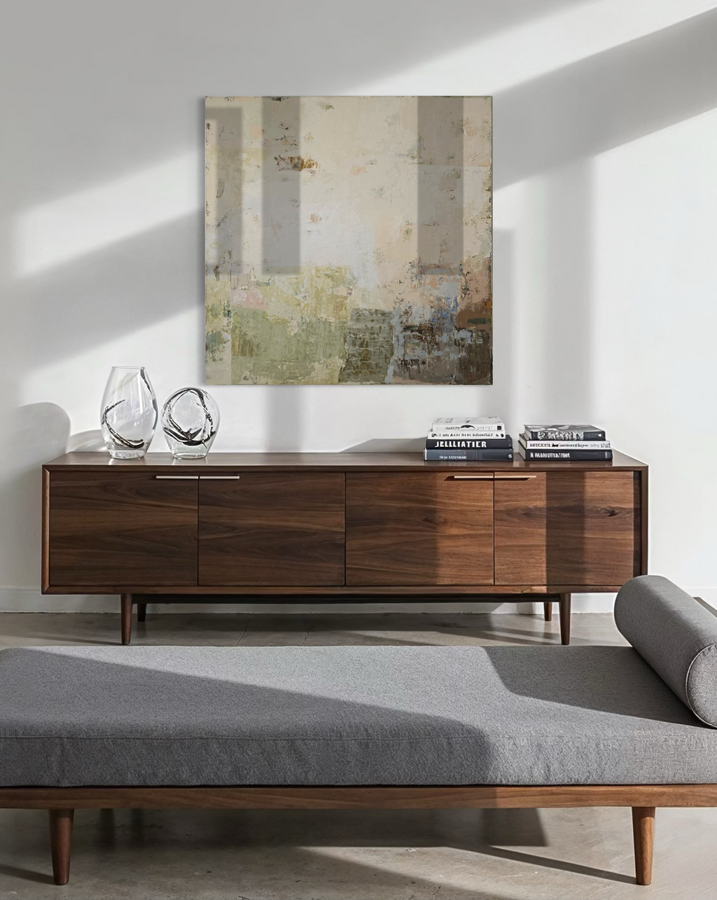 Original Abstract Painting by Birute Studio above wooden sideboard with decorative items in a living room setting.